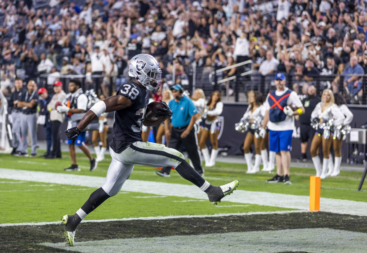 Raiders running back Brittain Brown (38) celebrates into the end zone versus the New England Pa ...