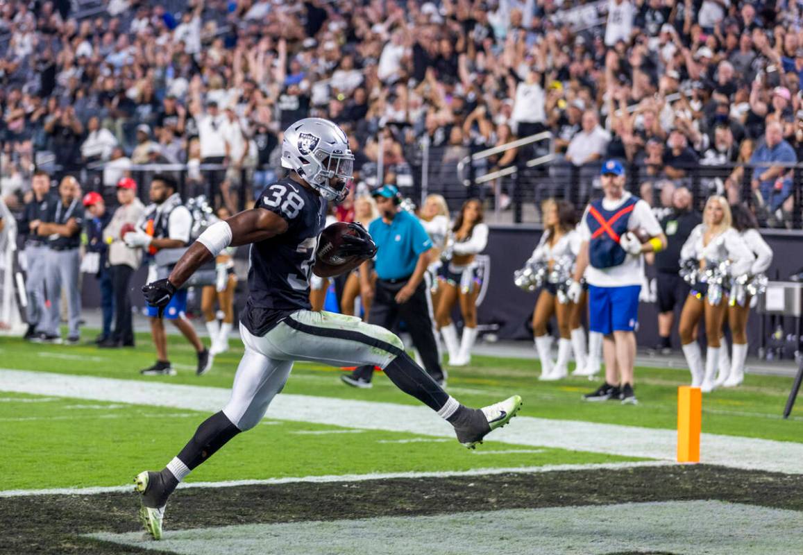 Raiders running back Brittain Brown (38) celebrates into the end zone versus the New England Pa ...