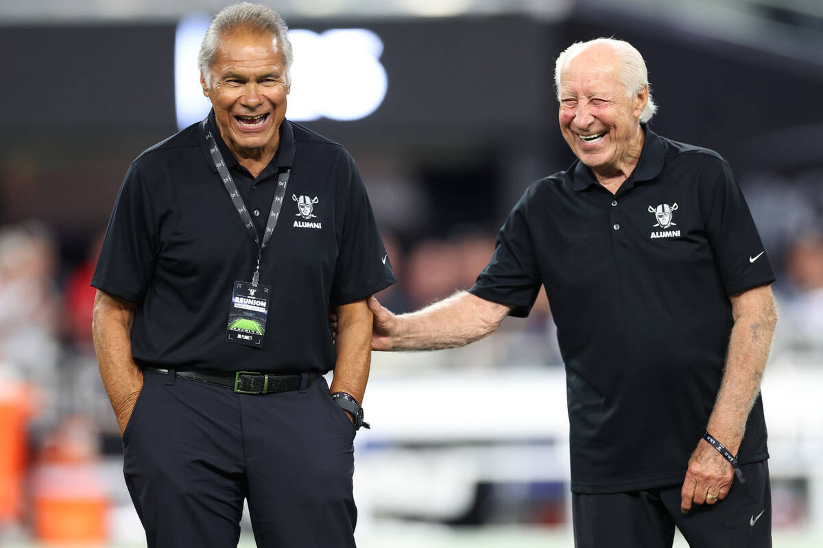 Raiders alumni Jim Plunkett, left, and Fred Biletnikoff, are honored with other retired players ...