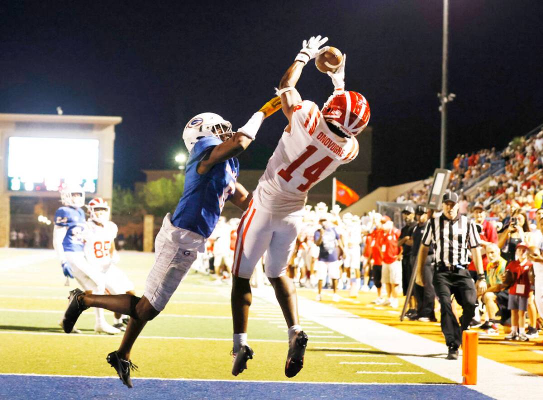 Mater Dei's wide receiver Jordan Onovughe (14) catches a touchdown pass as Bishop Gorman's defe ...