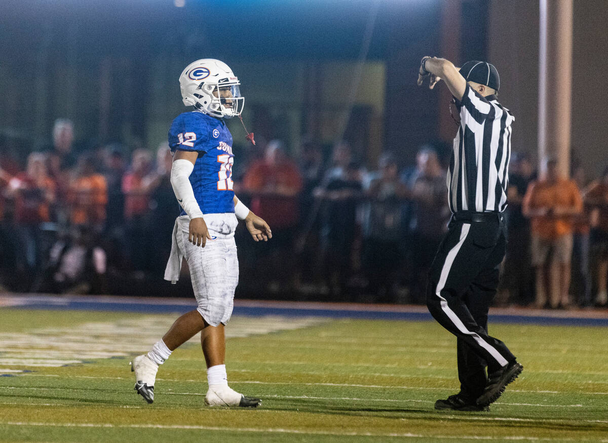 Bisho Gorman's quarterback Elijah Brown (12) leaves the field after the last play of their game ...