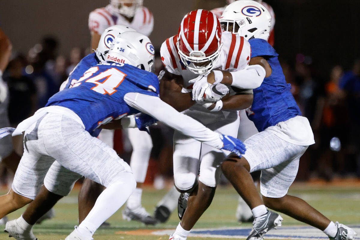 Mater Dei's wide receiver Jordan Onovughe (14) runs through Bishop Gorman defends during the se ...