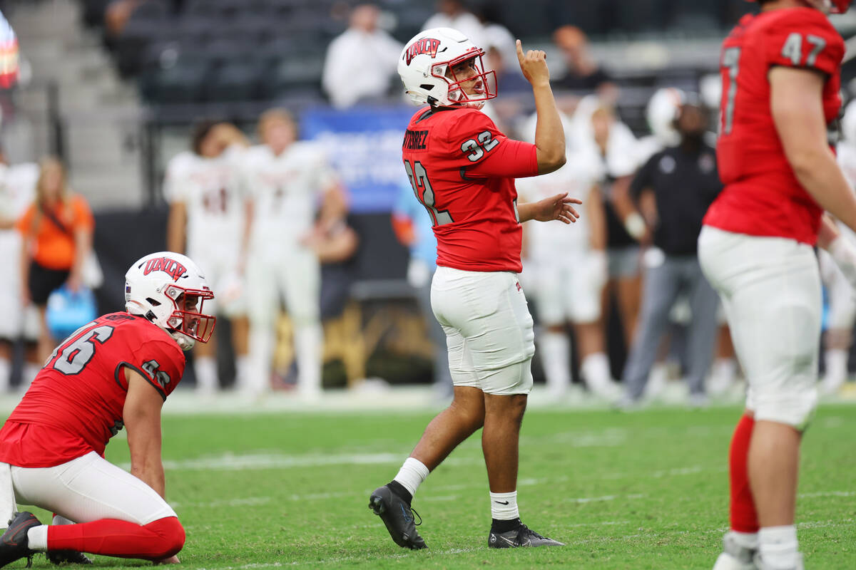 UNLV Rebels place kicker Daniel Gutierrez (32) scores an extra point kick against the Idaho Sta ...