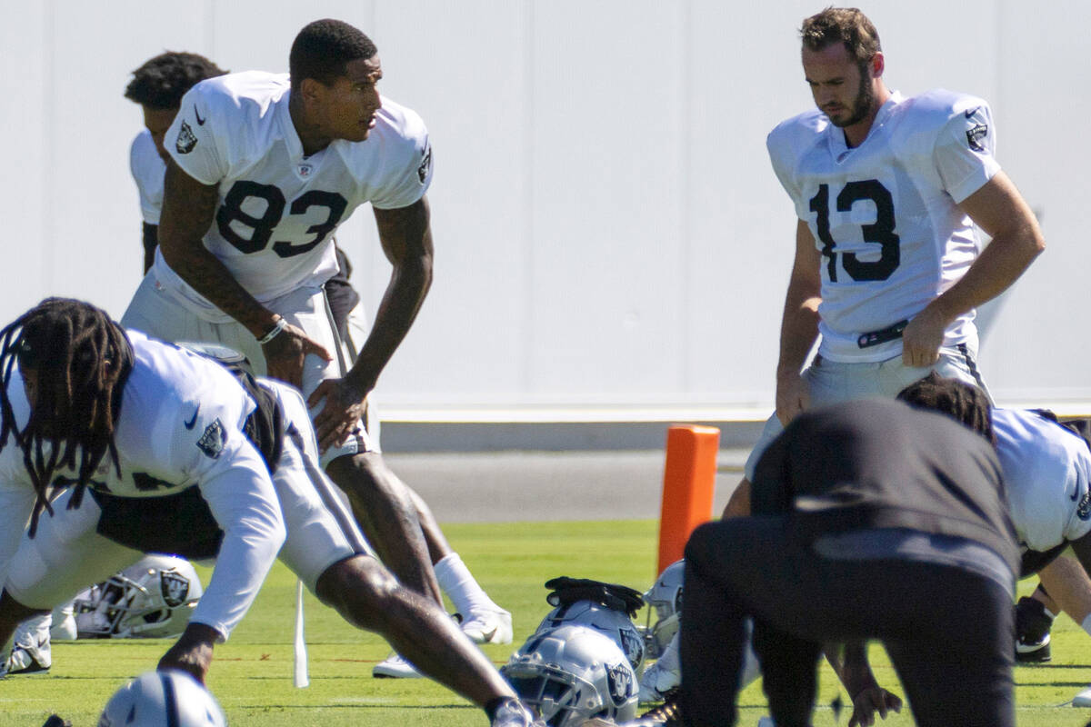 Raiders tight end Darren Waller (83) and Raiders wide receiver Hunter Renfrow (13) stretch duri ...