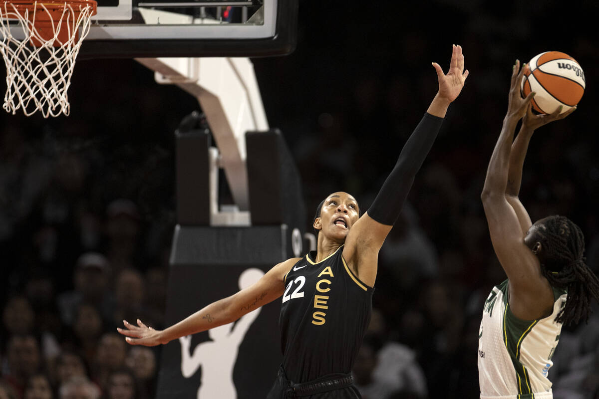 Las Vegas Aces forward A'ja Wilson (22) blocks a shot by Seattle Storm center Tina Charles (31) ...