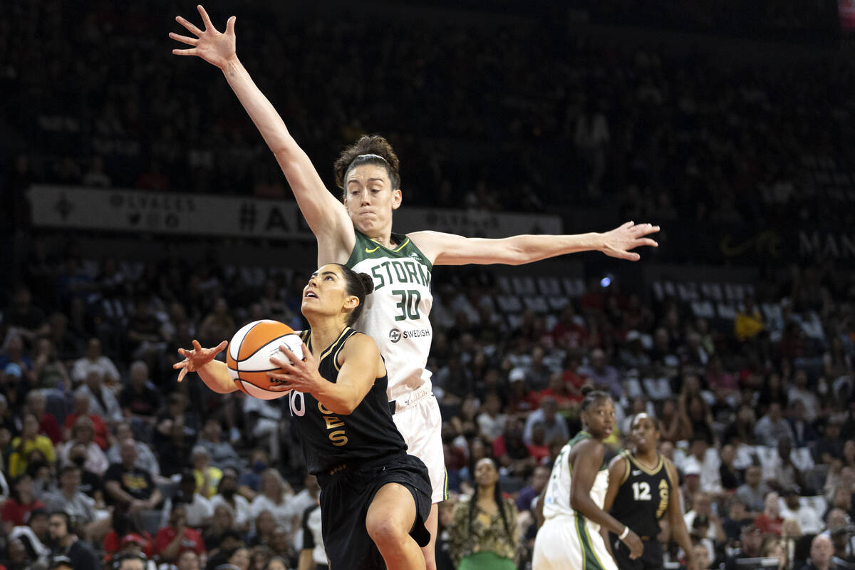 Las Vegas Aces guard Kelsey Plum (10) shoots against Seattle Storm forward Breanna Stewart (30) ...