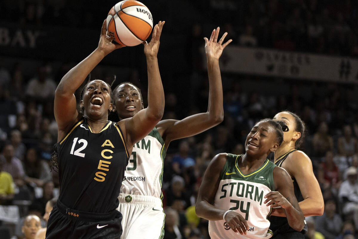 Las Vegas Aces guard Chelsea Gray (12) shoots against Seattle Storm center Ezi Magbegor (13) du ...