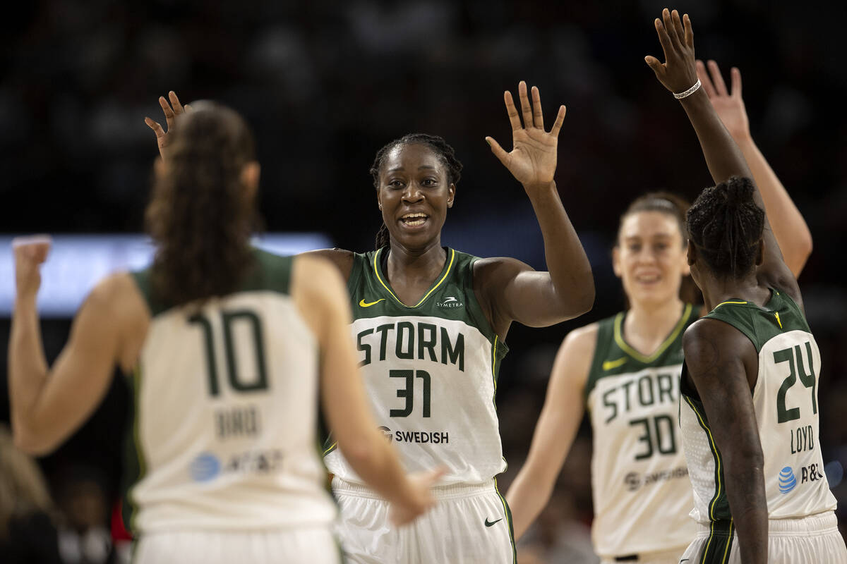 Seattle Storm guard Sue Bird (10), center Tina Charles (31), forward Breanna Stewart (30) and g ...