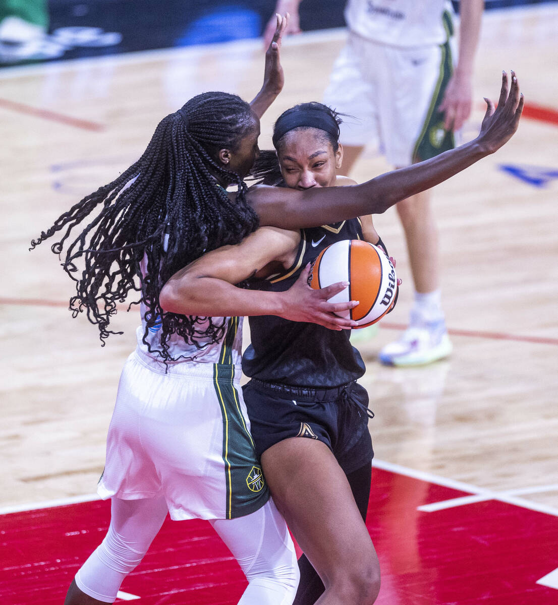 Seattle Storm center Tina Charles (31) blocks a drive by Las Vegas Aces forward A'ja Wilson (22 ...