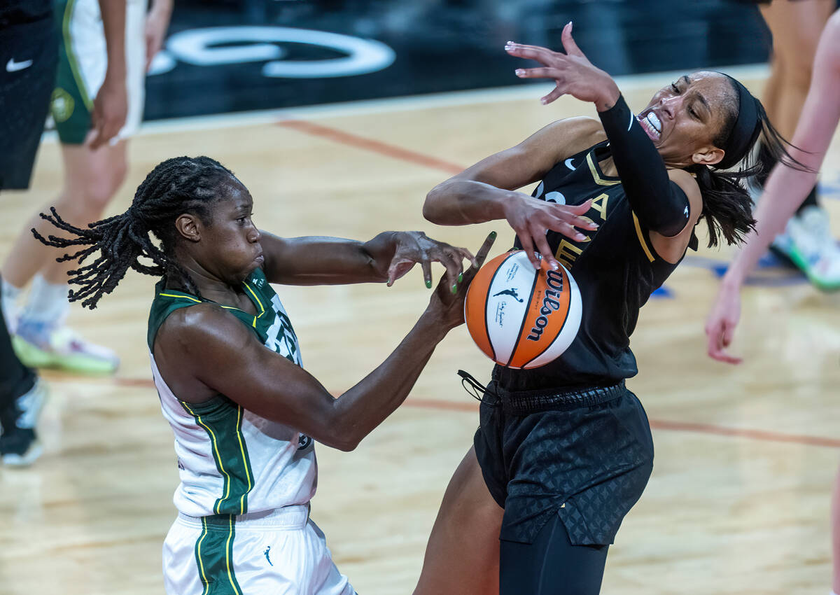 Seattle Storm center Tina Charles (31) rips the ball from Las Vegas Aces forward A'ja Wilson (2 ...