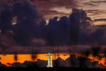 The NASA moon rocket stands ready at sunrise on Pad 39B before the Artemis 1 mission to orbit t ...