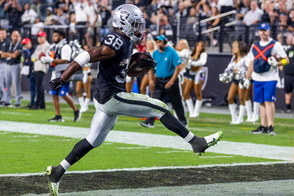 Raiders running back Brittain Brown (38) celebrates into the end zone versus the New England Pa ...