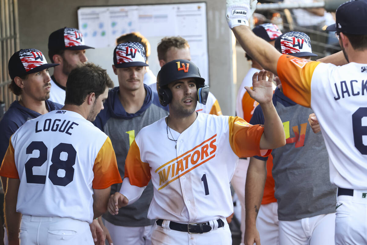 Las Vegas Aviators' Kevin Smith (1) celebrates his run against Round Rock Express during a mino ...