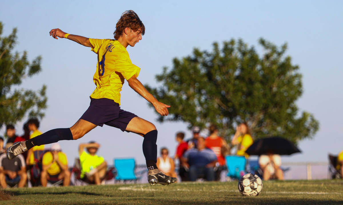 Shadow Ridge’s Paul Jankowski (19) kicks the ball against Silverado during a soccer game ...