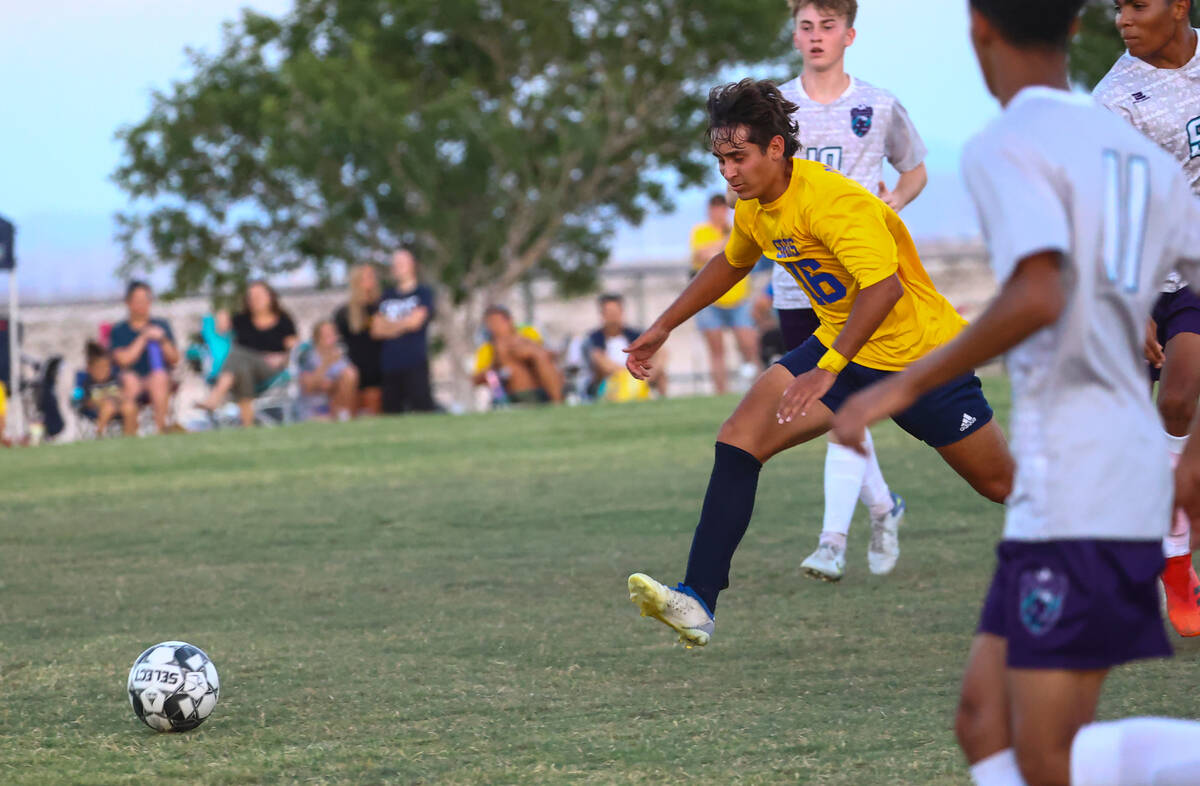 Shadow Ridge midfielder Gavin Houghton (16) chases after the ball during a soccer game against ...