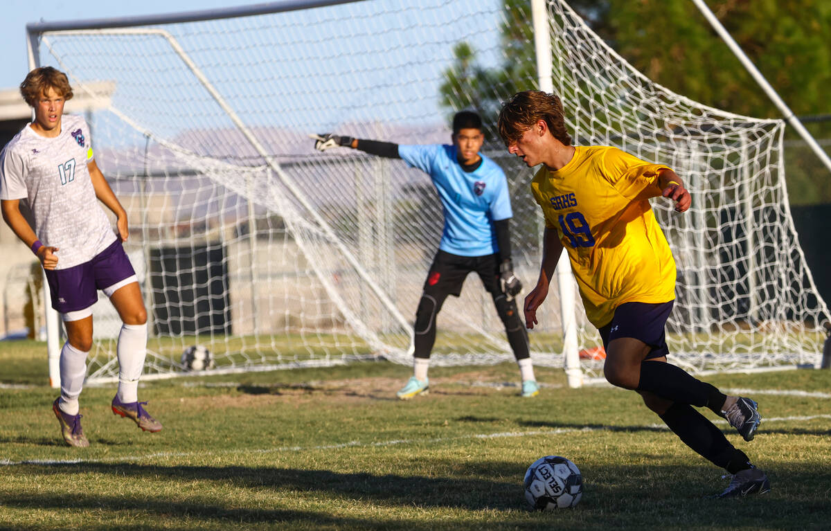 Shadow Ridge’s Paul Jankowski (19) moves the bal against Silveradol during a soccer game ...