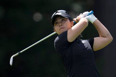 Danielle Kang, from the United States, watches an approach shot on the 3rd hole during the thir ...
