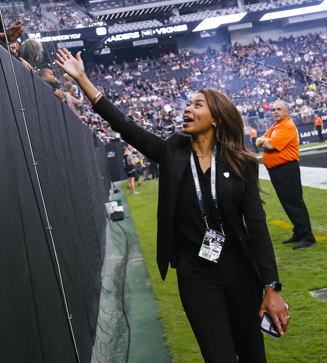 Sandra Douglass Morgan, president of the Raiders, greets fans during the first half of an NFL p ...