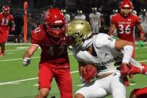 Arbor View linebacker Christian Thatcher prepares to tackle a Snow Canyon (Utah) during a 7-0 w ...