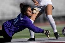 Cimarron-Memorial goalkeeper Sarah Portillo dives to save a shot by Bonanza during a girls Clas ...