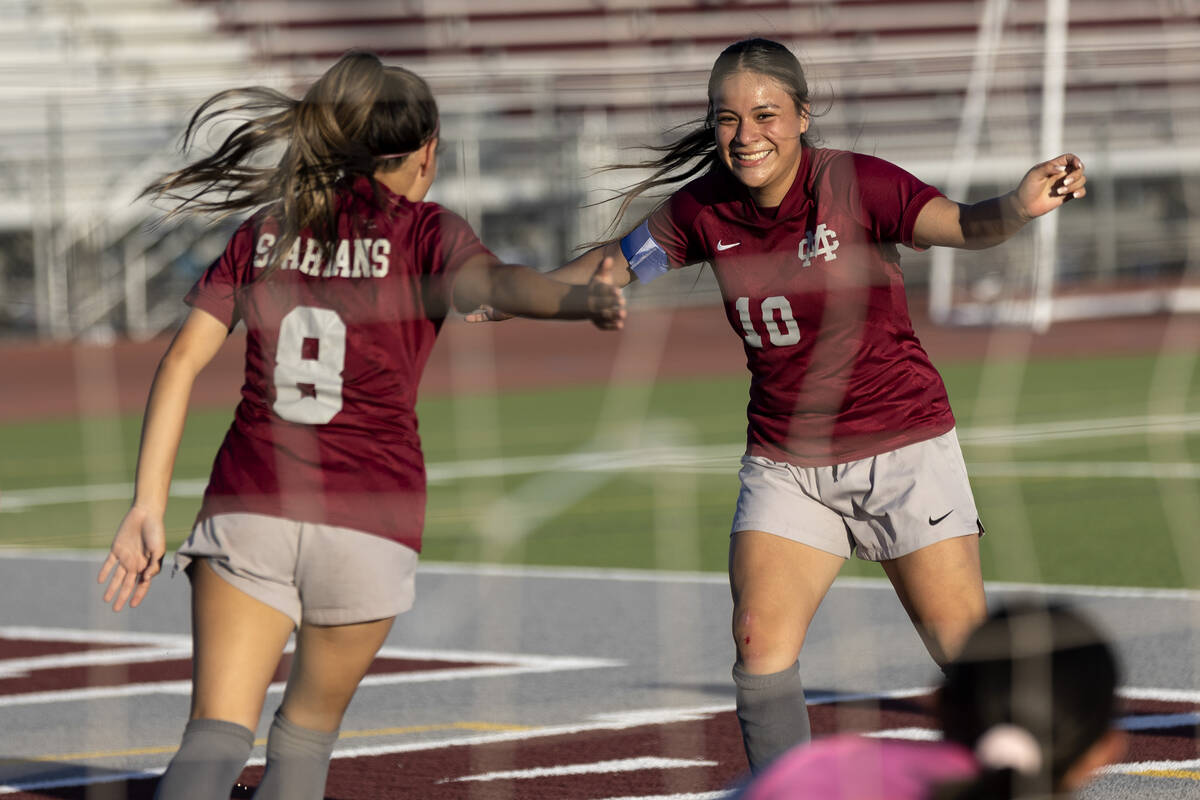 Cimarron-Memorial forwards Jasmin Chavarria-Lopez (8) and Melinda Bravo-Avendano (10) celebrate ...