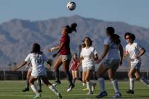 Cimarron-Memorial midfielder Kasandra Dominguez (9) heads the ball as Bonanza players close in ...