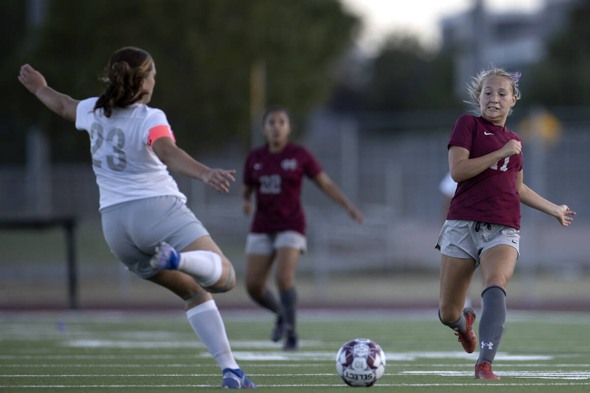 Bonanza’s Lauren Weinand (23) kicks possession away from Cimarron-Memorial midfielder Ta ...
