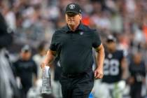 Raiders head coach Jon Gruden runs off the field for halftime during an NFL football game again ...
