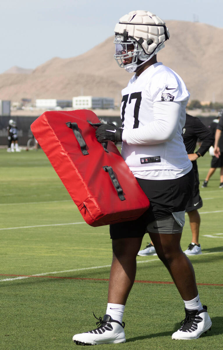 Raiders offensive tackle Thayer Munford (77) walks the field during the team’s training ...