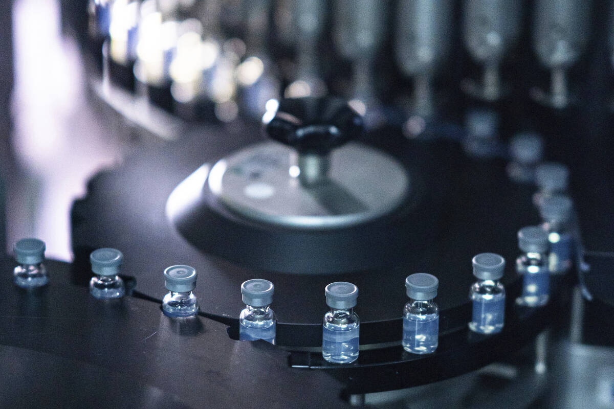 This August 2022 photo provided by Pfizer shows vials of the company's updated COVID-19 vaccine ...