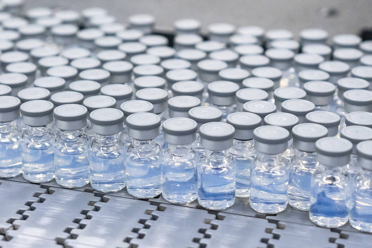 This August 2022 photo provided by Pfizer shows vials of the company's updated COVID-19 vaccine ...