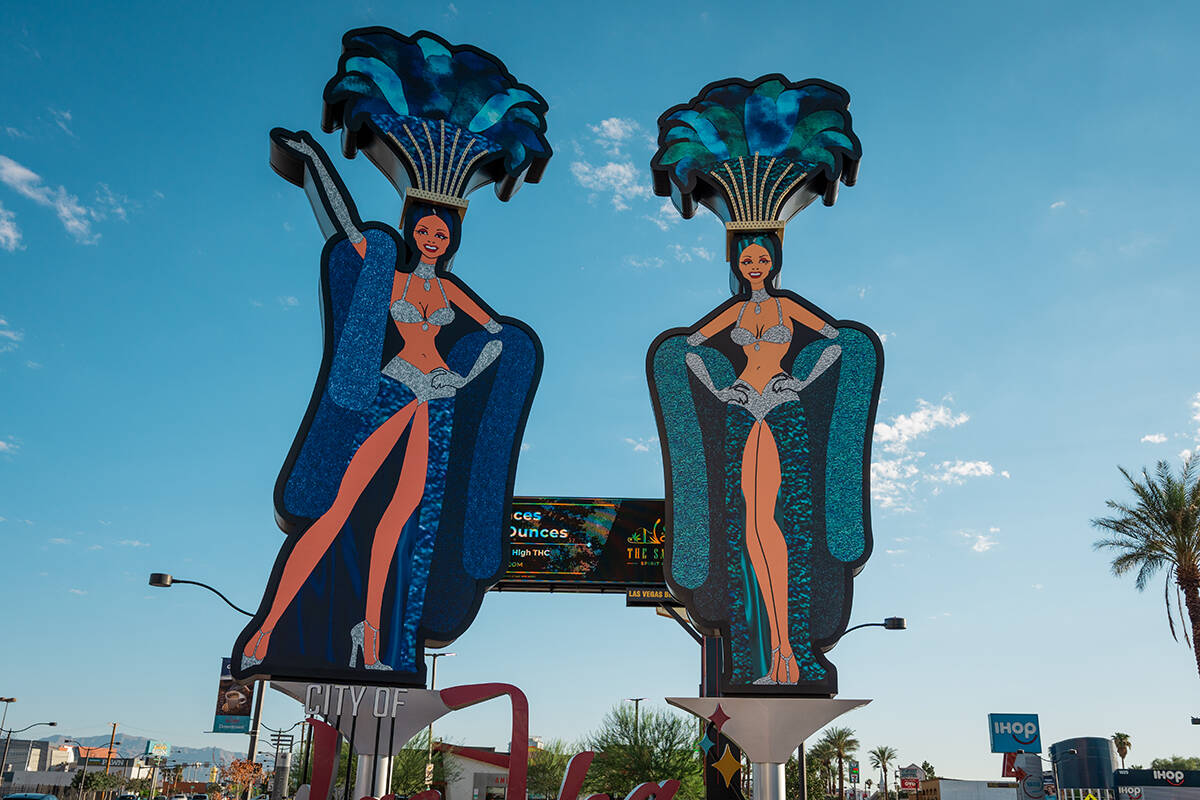 Two brand-new, 50-foot-tall showgirls have been installed on the corner of Main Street and Las ...