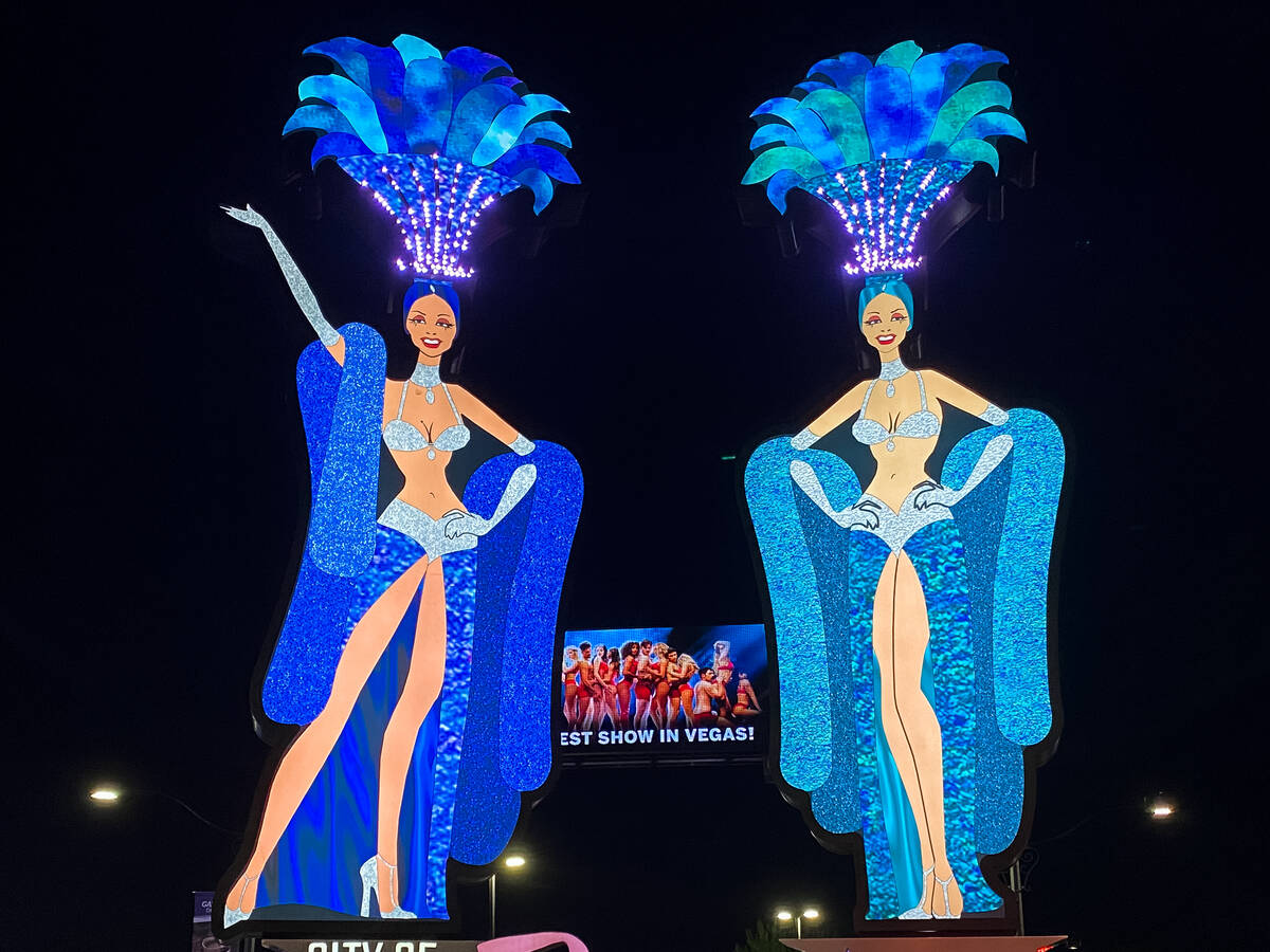 The previously installed, 25-foot-tall showgirl signs that were near the Strat, shown here, are ...