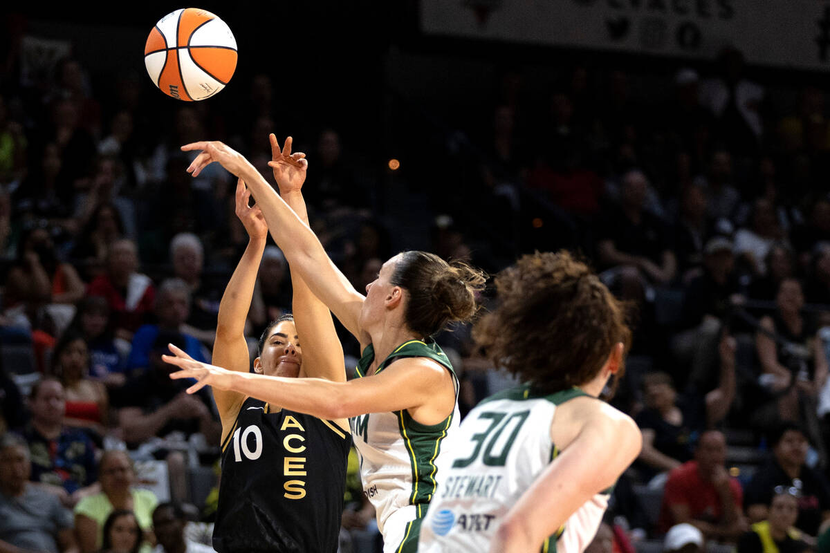 Seattle Storm forward Stephanie Talbot (7) knocks a shot away from Las Vegas Aces guard Kelsey ...