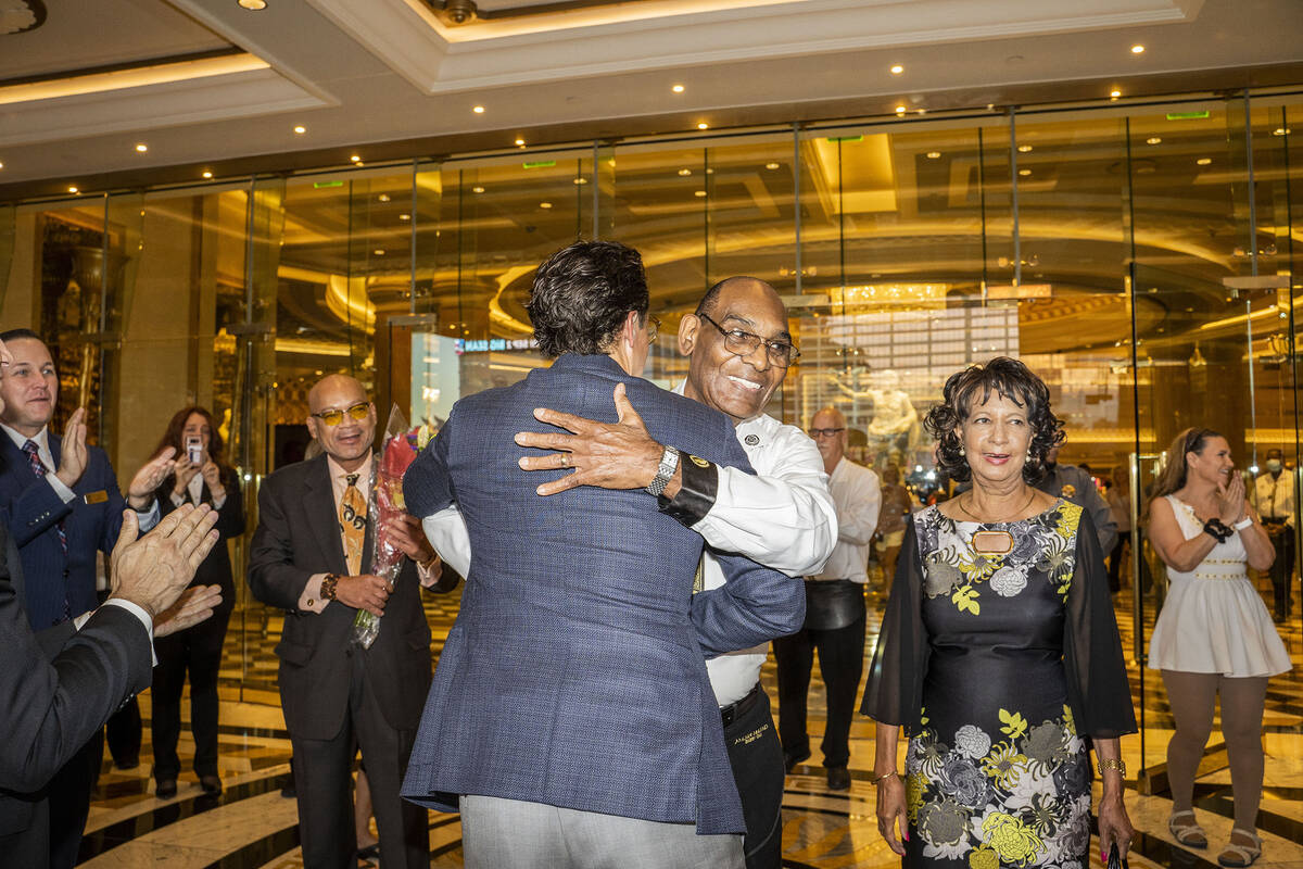 Regional President of Caesars Entertainment Sean McBurney gives Benny Figgins a hug. He also re ...