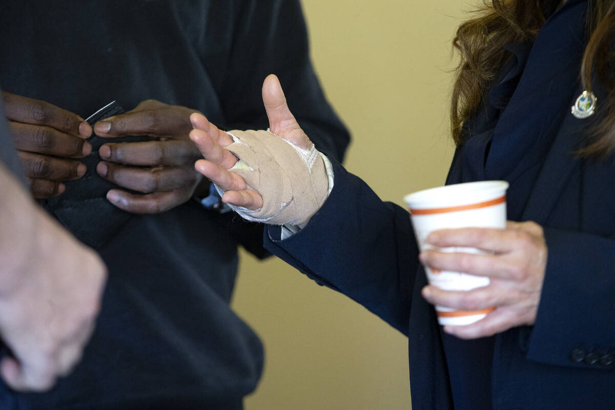 City councilwoman Victoria Seaman wears a bandage on her hand after undergoing surgery on the f ...