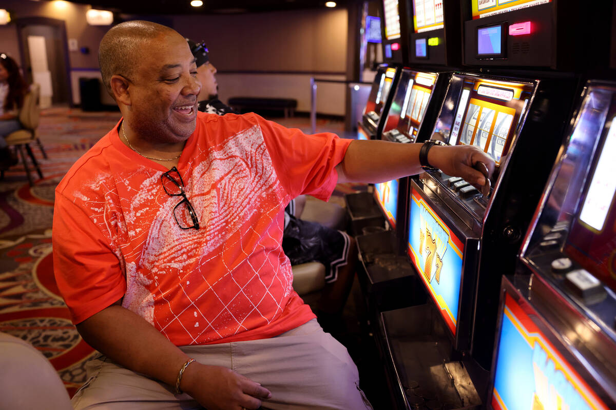 James Knight of Columbus, Ohio plays coin slot machines at Circus Circus in Las Vegas Friday, A ...