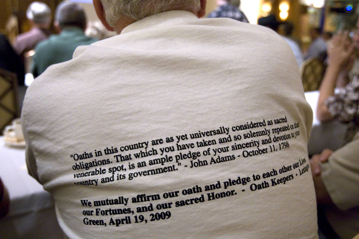 Jim Bridgens of Madison, Ohio dons an oath shirt at the Oath Keepers inaugural national confere ...