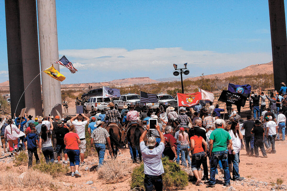 The Bundy family and their supporters gather together under the Interstate 15 highway just outs ...