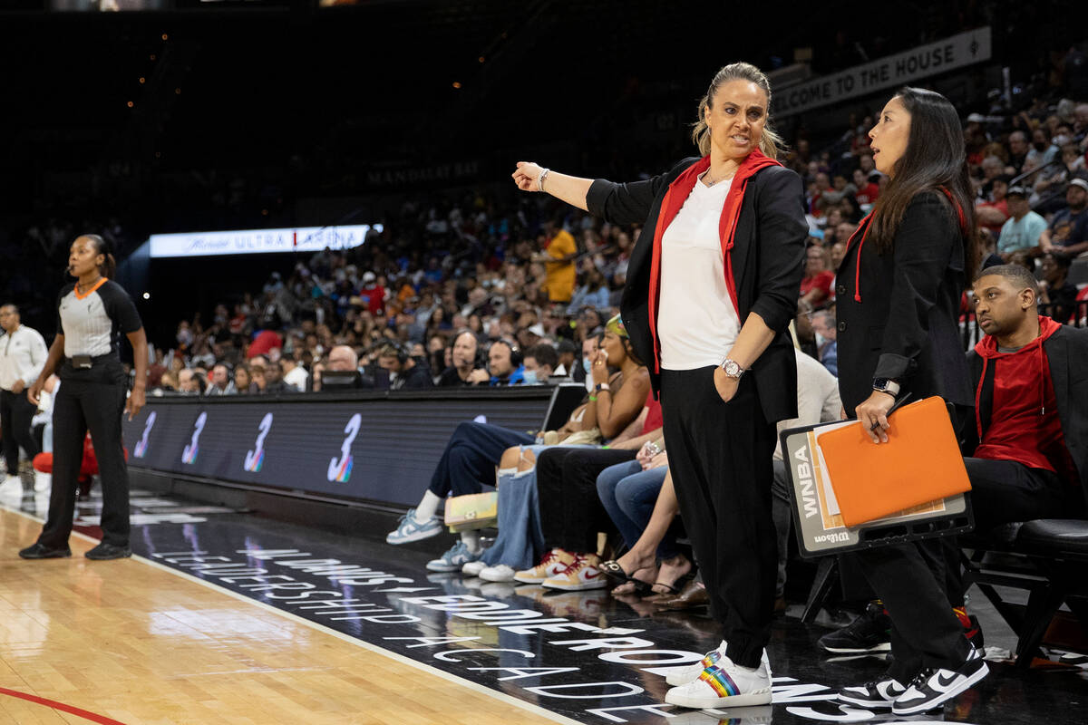 Las Vegas Aces head coach Becky Hammon and assistant coach Natalie Nakase communicate on the si ...