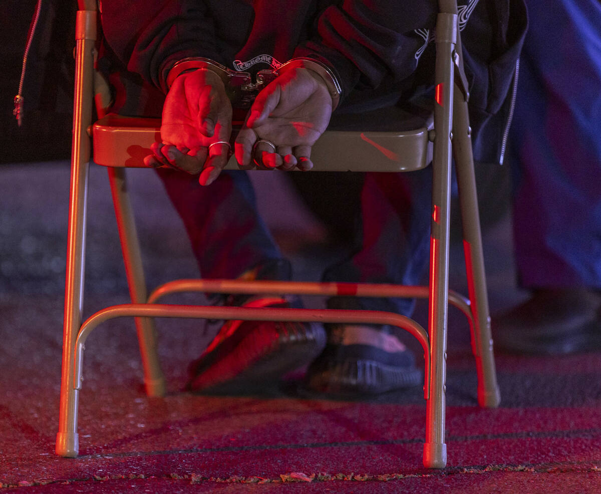 Impaired driving suspect Mike Soto sits for a blood sample during the Metro DUI Blitz on Saturd ...