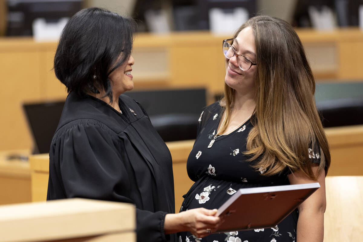 Judge Cynthia Leung presents Morgan Savage with her certificate during a WIN Court graduation c ...