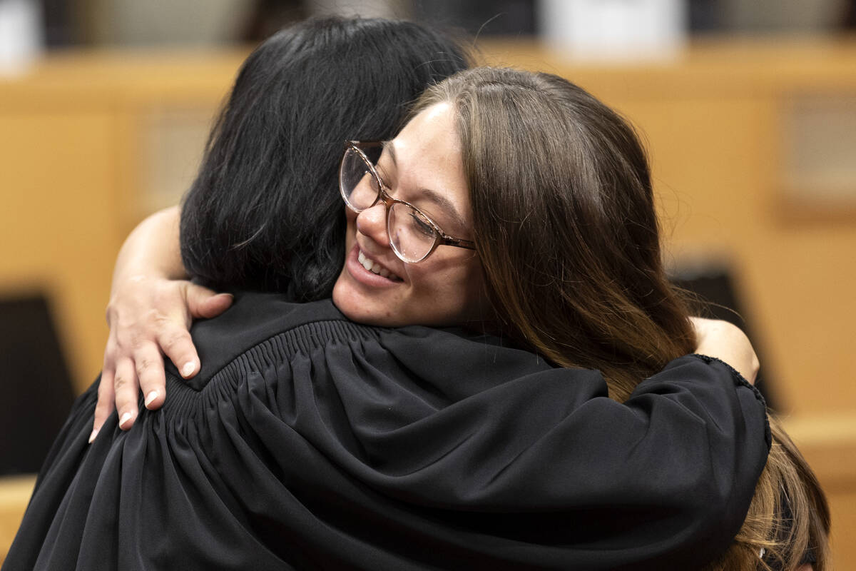 Judge Cynthia Leung hugs Morgan Savage during a WIN Court graduation ceremony at Las Vegas City ...