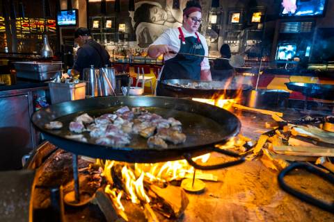 Chef Stephanie Sandfrey prepares Paella over an open flame at Jaleo in The Cosmopolitan of Las ...
