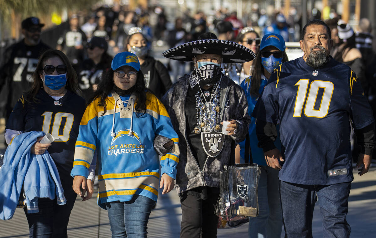 Raiders and Los Angeles Chargers fans before the start of an NFL football game on Sunday, Jan. ...