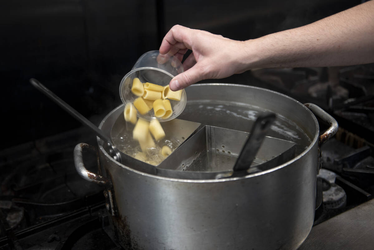 Robert Moore, chef and owner of Rosa Ristorante, prepares the restaurant's Rigatoni Alla Vodka ...