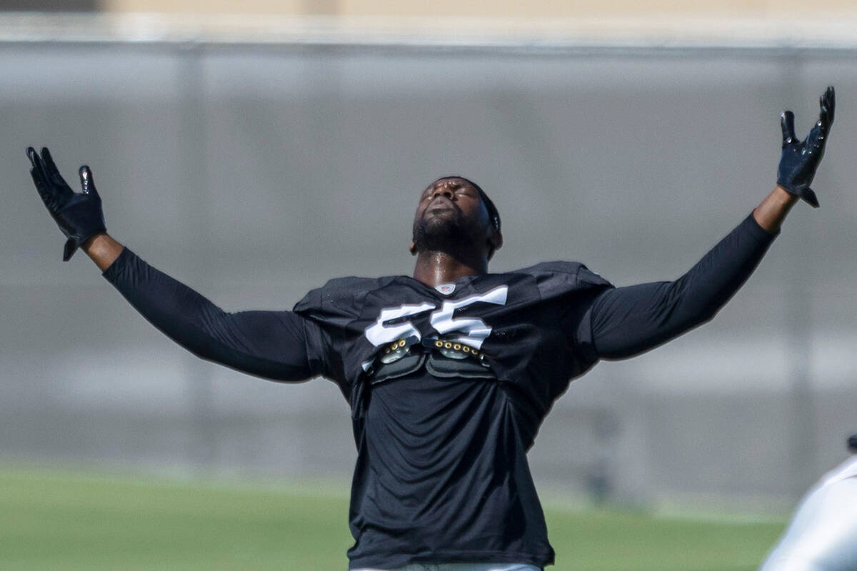 Raiders defensive end Chandler Jones (55) stretches during practice at the Intermountain Health ...