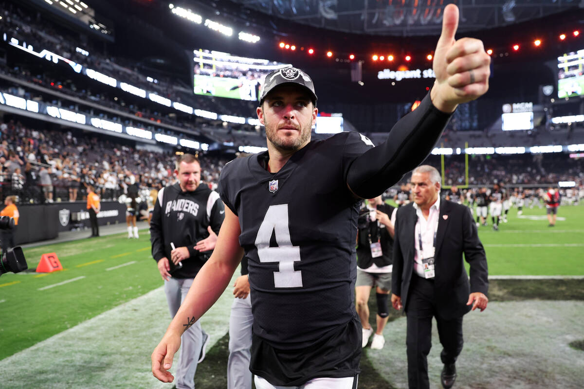 Raiders quarterback Derek Carr (4) leads the field at the end of a NFL preseason football game ...