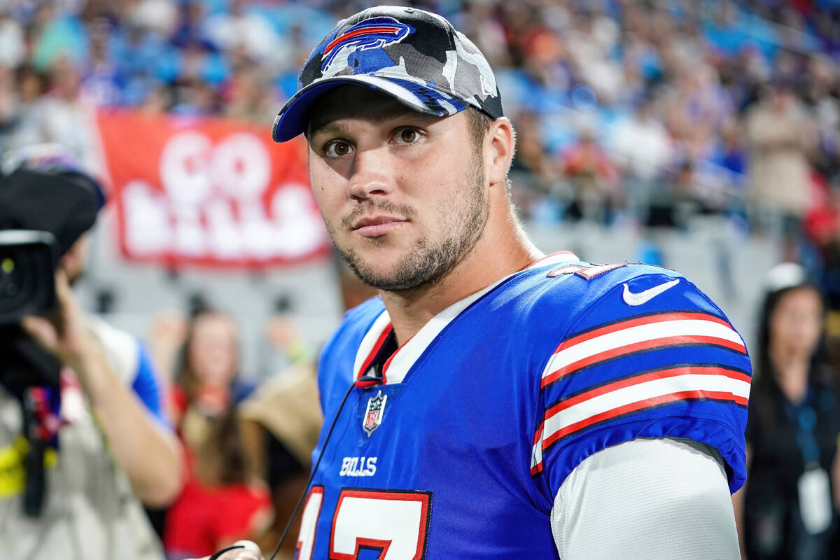 Buffalo Bills quarterback Josh Allen (17) watches play during an NFL preseason football game ag ...