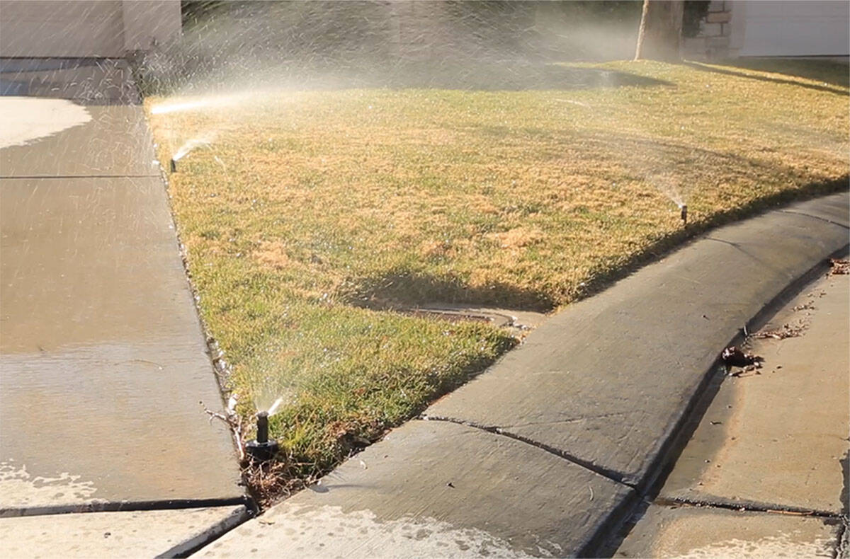 Water that falls outside of the grass can be considered a water waste violation. (Las Vegas Val ...